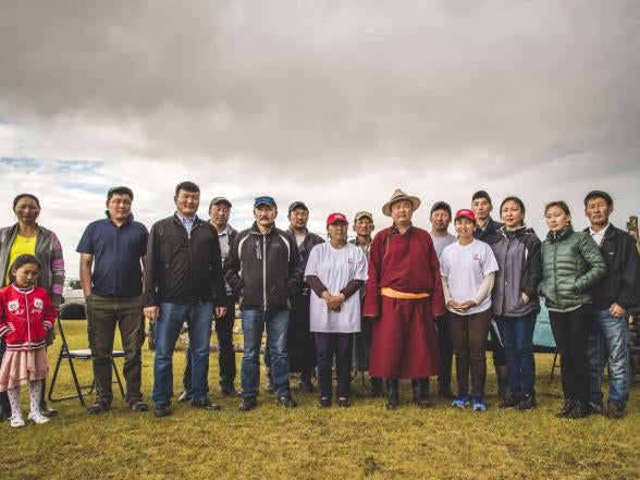 A large group of people posing for a group photo.