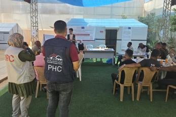 A capacity building session for site management committees in gaza. committees are the first point where a problem in a site is raised and recorded.