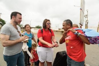 Prosper global employees speaking with venezuelan family