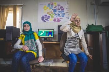 Two girls at the makani center (prosper global youth safe space) in zaatari refugee camp