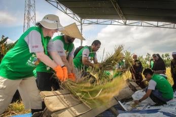 Prosper Global employees doing agricultural work