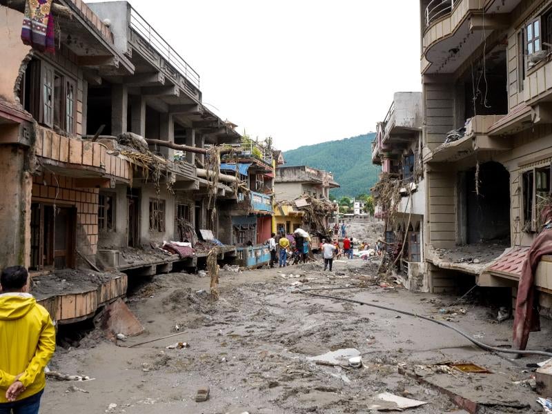 People assess damage in Rasuwa District, Bagmati Province in the wake of the devastating flood in northern Nepal.