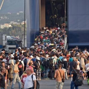 Refugees board the daily ferry from the island of lesbos to athens, greece. those who can't make it onboard must wait another day for the next ferry. photo: graham niven/prosper global