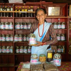 Women aren't often involved in business in rural nepal, but 59-year-old harikala is the strong leader of her family's bustling pickle shop.
