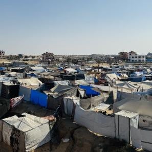 A displacement site in gaza, where families live in shelters made of fabric and plastic sheeting. more than eight in ten sites across the strip are makeshift.