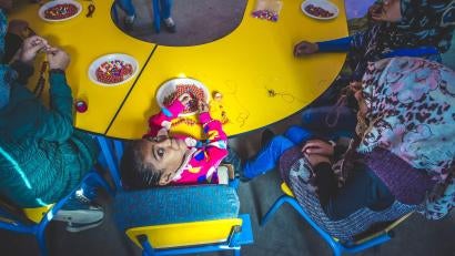 Recreational activities for the class, like beading, help foster acceptance and prevent any discrimination Malak might face for being different. They also provide additional physical exercise, which helps meet her needs without stigmatizing her.