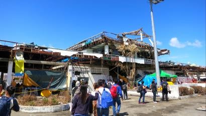 The Tacloban Airport was barely standing after Haiyan ripped through its roof and walls. The airport was the scene of chaos for days after the storm as people desperately tried to get off the island for help. Photos: Dewi Hanifah/Prosper Global