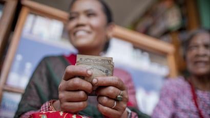 Woman holding cash