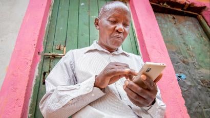 Kenyan man on his smartphone