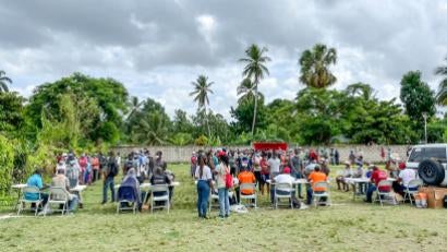 L’Asile residents pick up essential supplies at a distribution event. The community is in a rural and difficult to reach area where people may not have access to supplies otherwise.