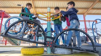 Yousef, left, plays at an inclusive playground at Zaatari refugee camp. Prosper Global inclusive education program supports schools at the camp, which houses the largest population of Syrian refugees.